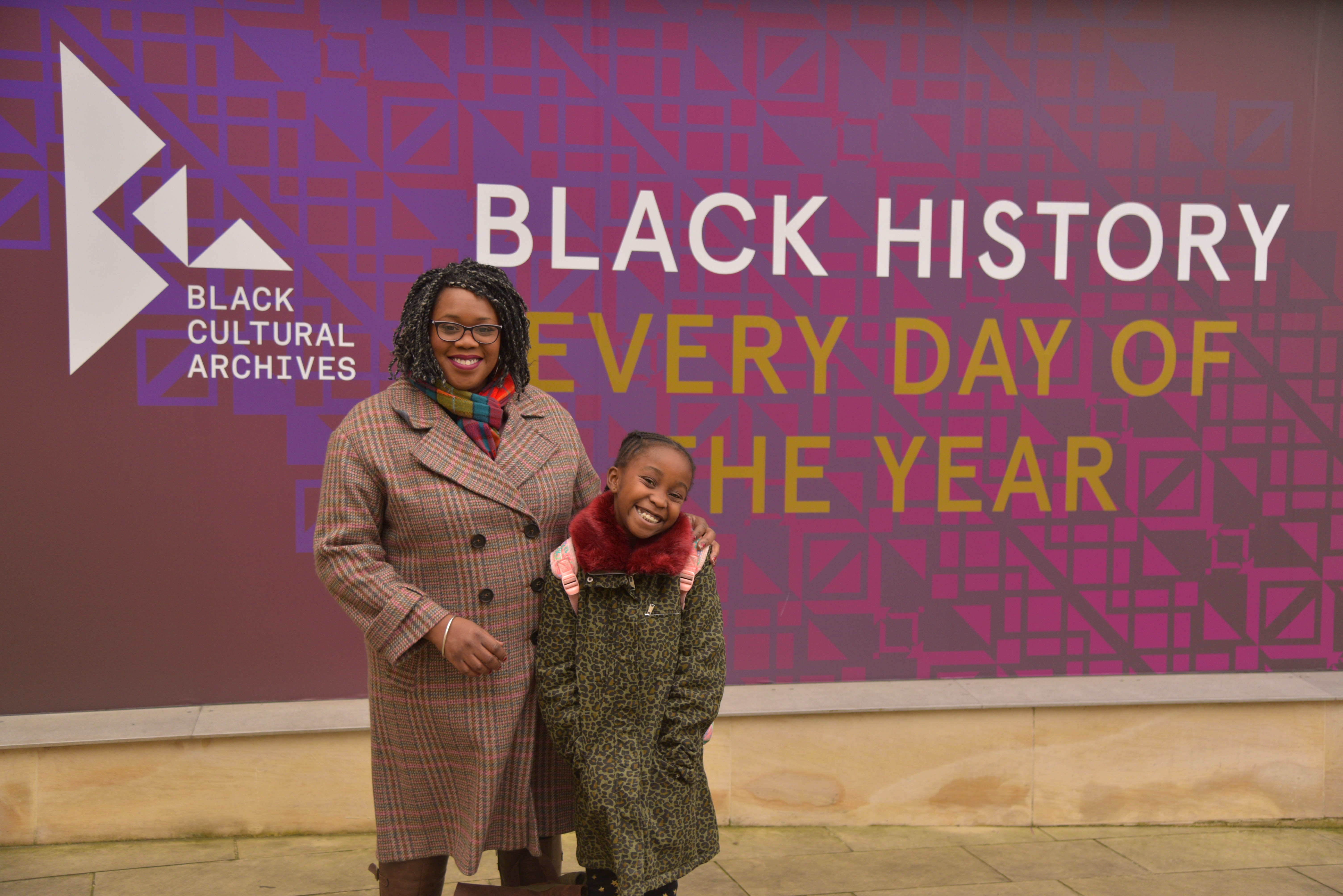 Lisa Phillip with daughter Miai visiting the Black Cultural Archives, London